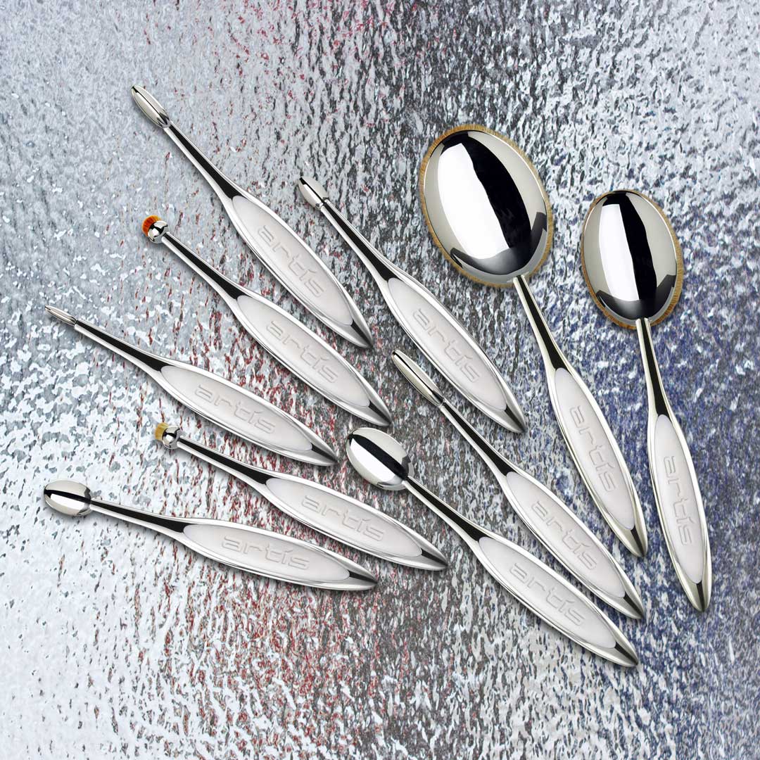 artis elite collection brushes in a spray pattern on a mottled surface