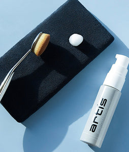 this is an image of the Artis Brush Cleaning Pad Essential version, along with an Elite Oval 6 brush and the Brush Cleansing Foam travel size.