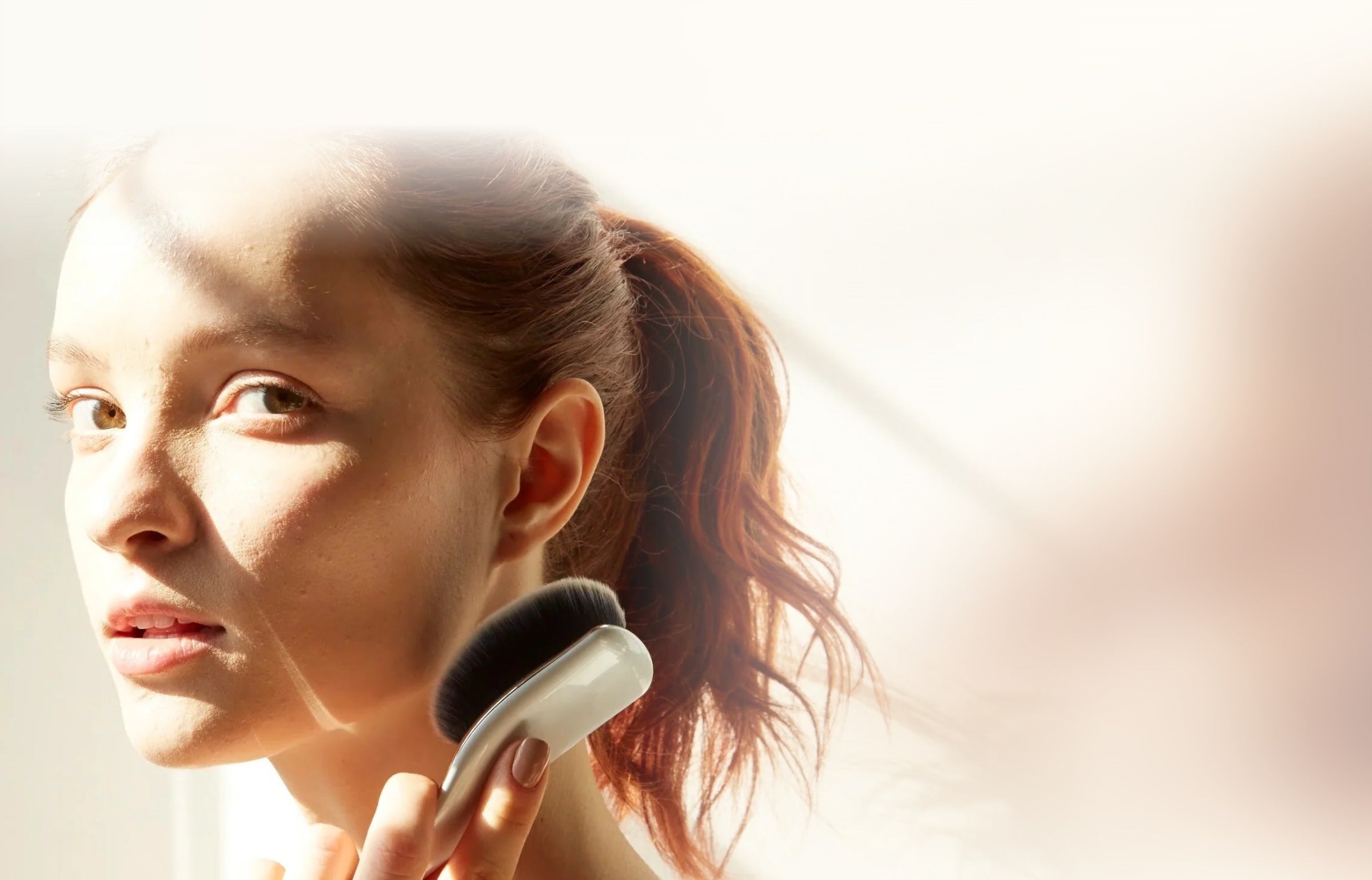 Sunlight across a model applying with an Artis brush