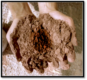 this is an image of two hands holding ground pigments to show how artists used ground up rocks and minerals as art mediums.